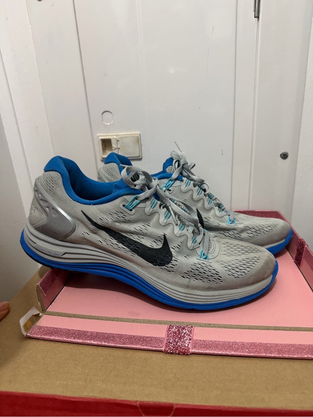 Nike Light Gray and Blue Running Shoes with Black Swoosh